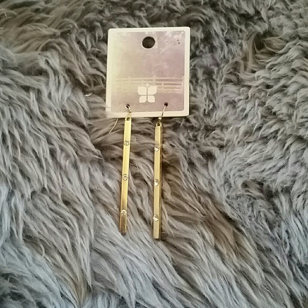 Gold earrings.